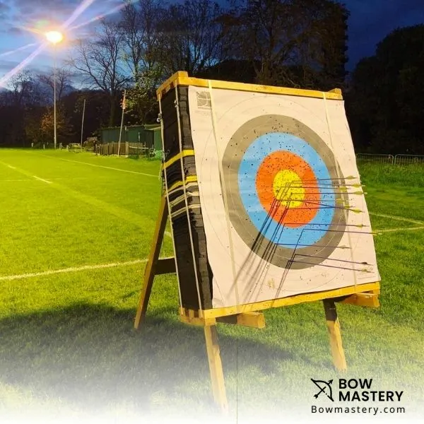 foam archery target with arrows in bullseye